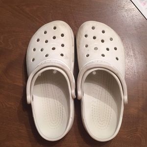 Size 7 women’s and 5 men’s white croc clogs